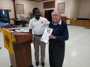 Robert "Bob" Schultz receives his 60 Year Membership Certificate from Commander-in-Chief Selom Adjogah at a recent Tuesday Lunch at the Valley.